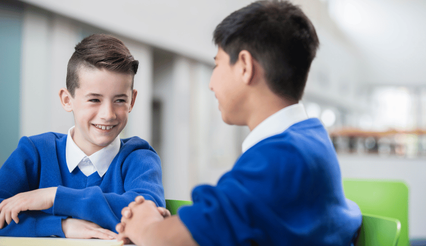 Two boys in blue school uniform